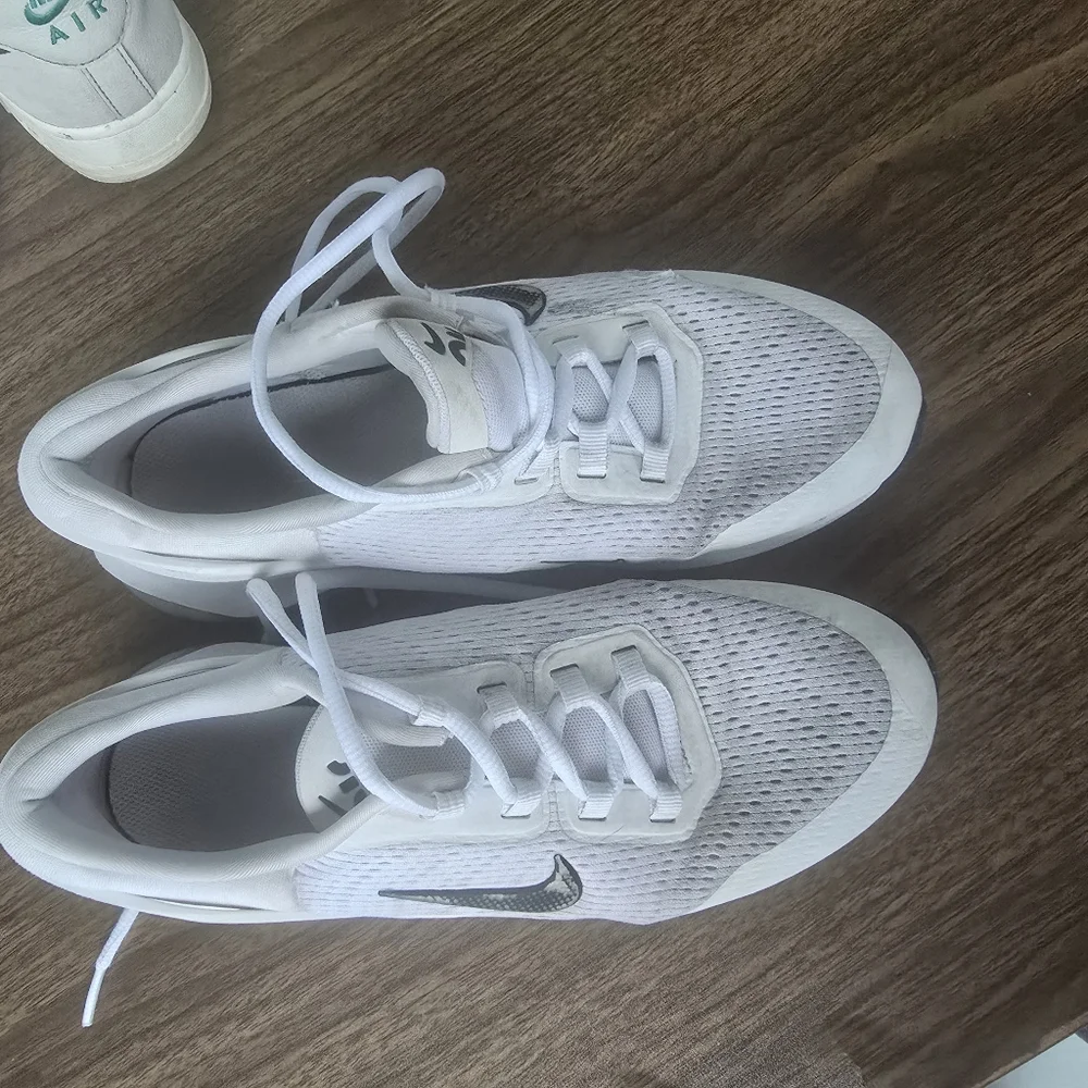 White Nike Sneakers with Black Swoosh